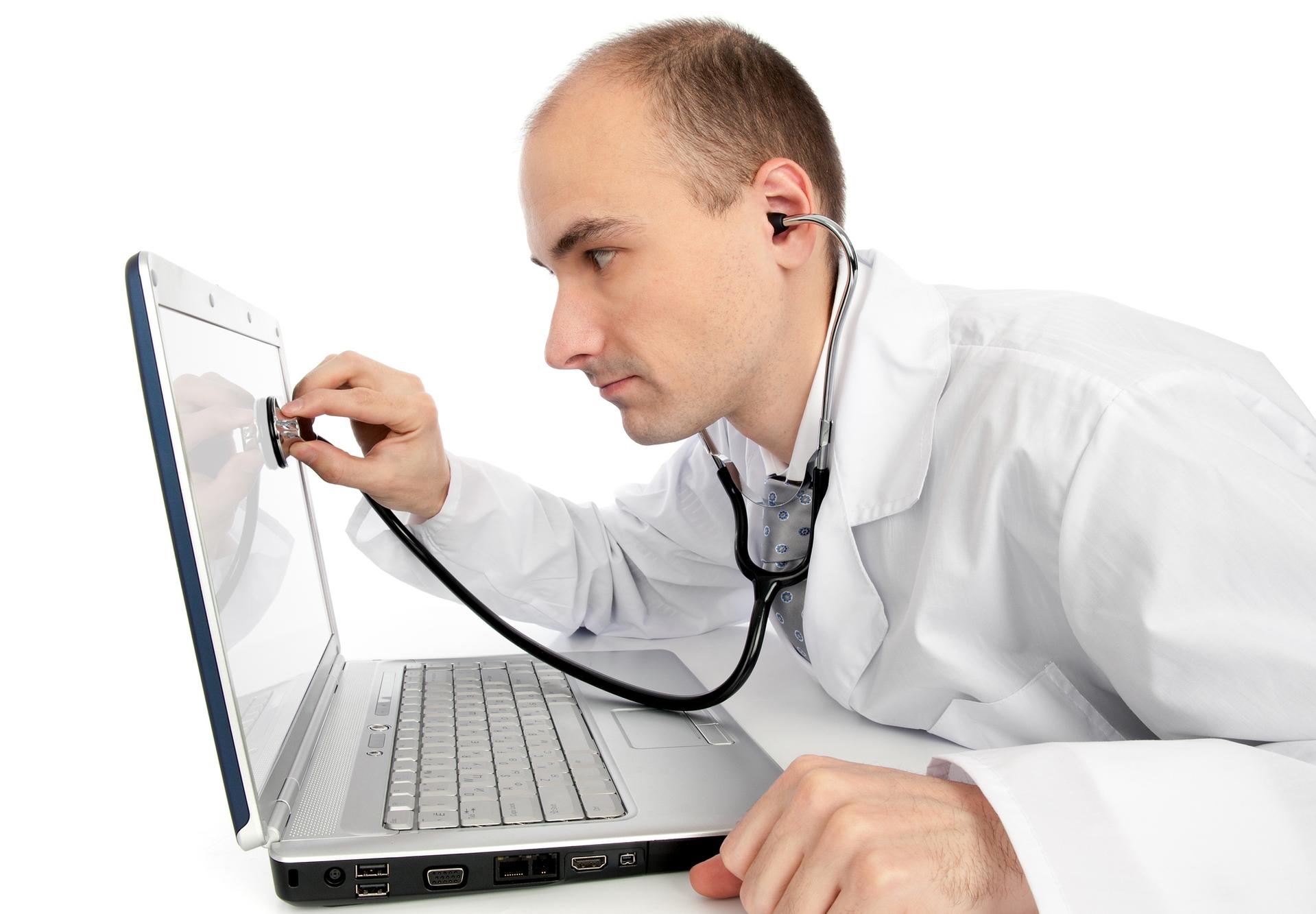 Doctor with stethoscope checking a laptop's health