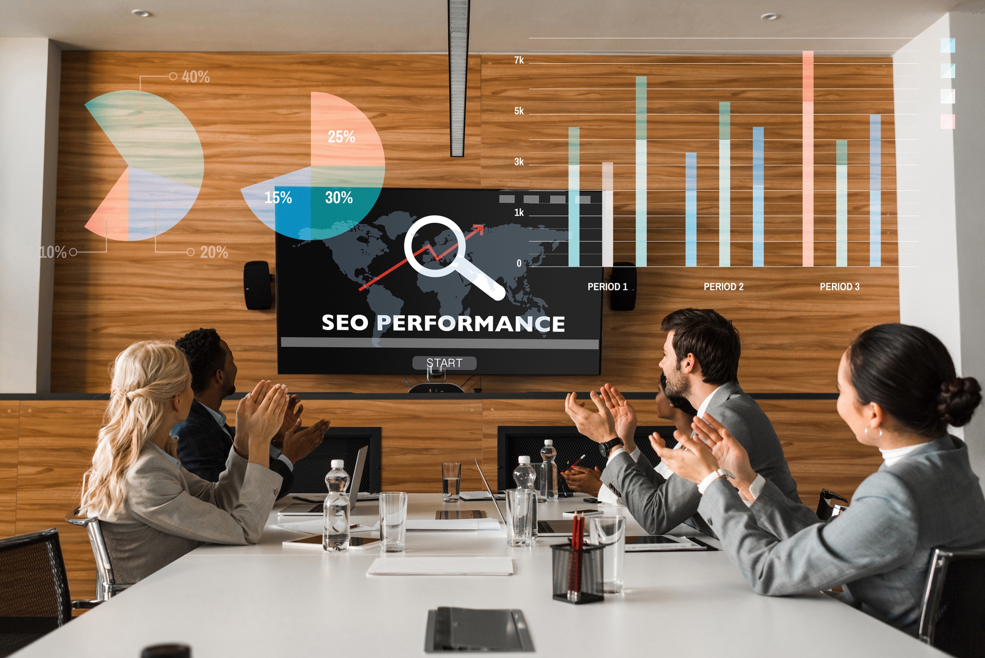 Young multicultural business people clapping while sitting in conference room viewing an SEO presentation on large monitor