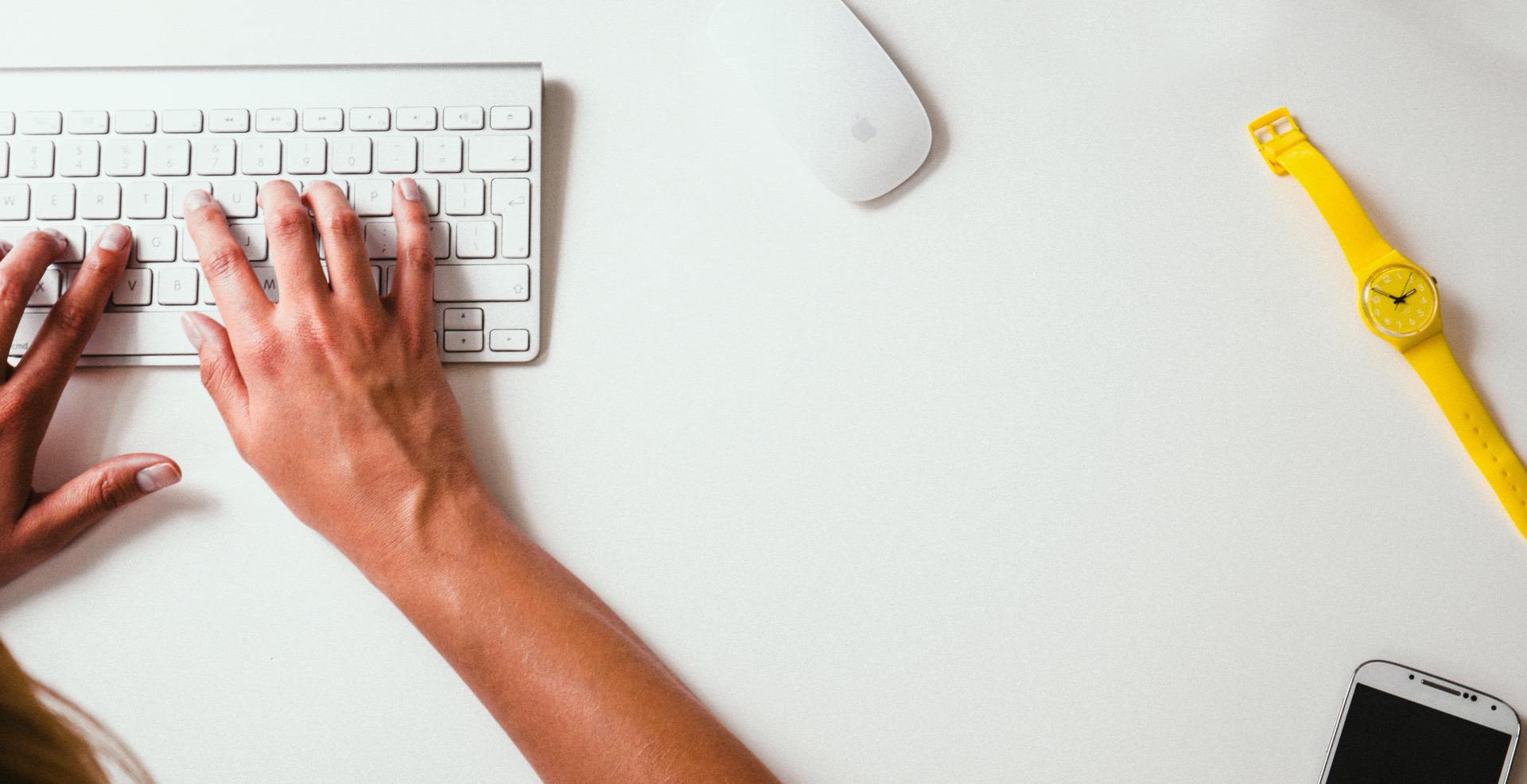 person typing on computer