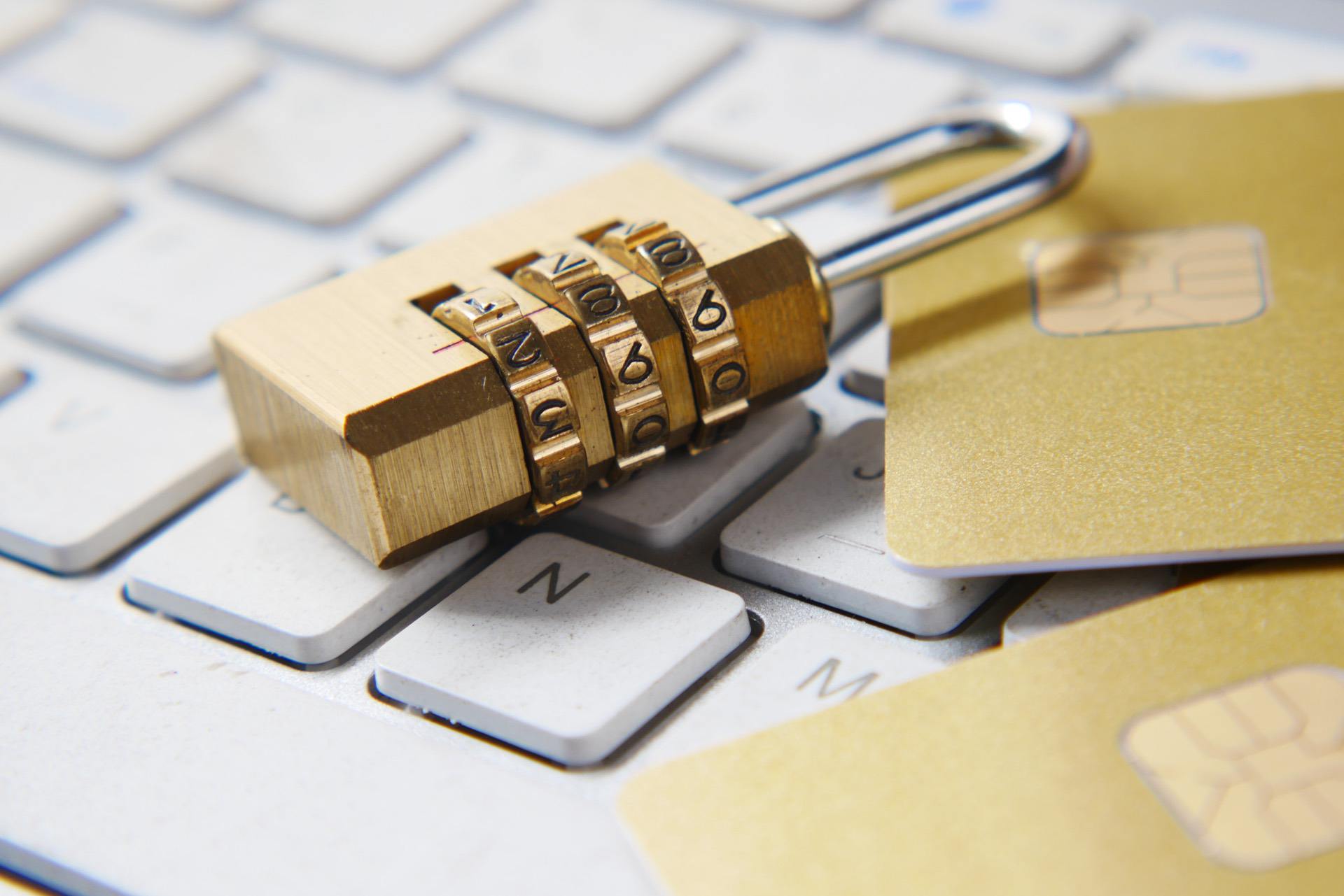A keyboard with a lock and credit cards