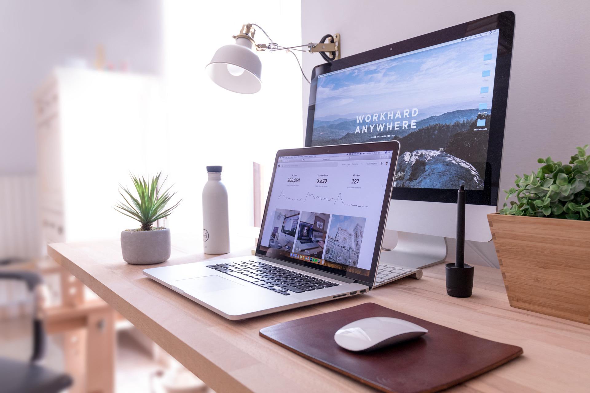 A laptop and a monitor demonstrating brand consistency and analysis